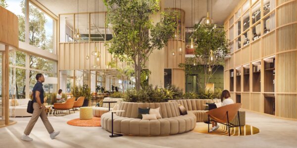 Moderne en groene kantoorlobby aan de Marten Meesweg met zithoeken, grote ramen en natuurlijke elementen.